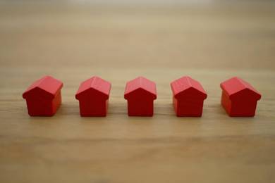 Five red monopoly houses